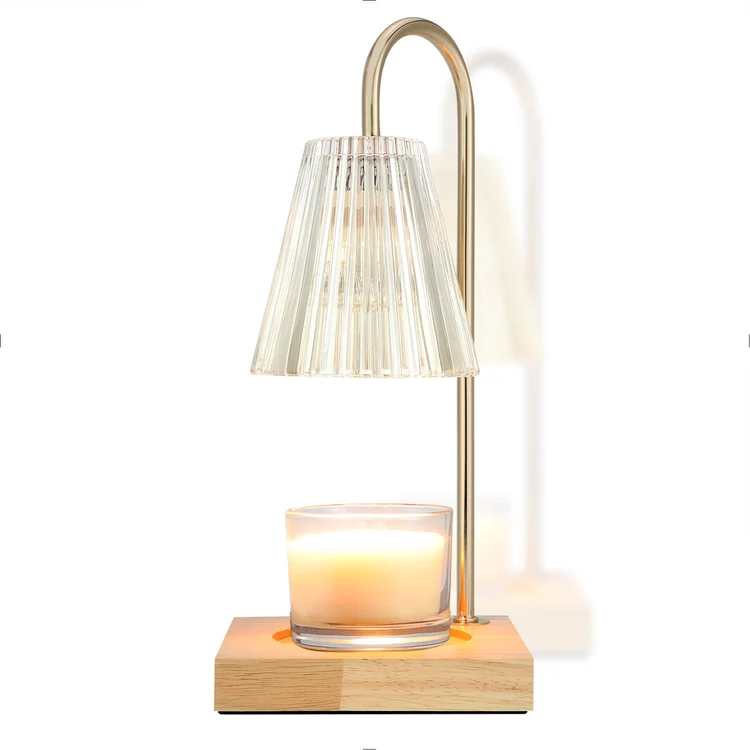 Vintage candle warmer lamp with a ribbed glass shade warming a jar candle